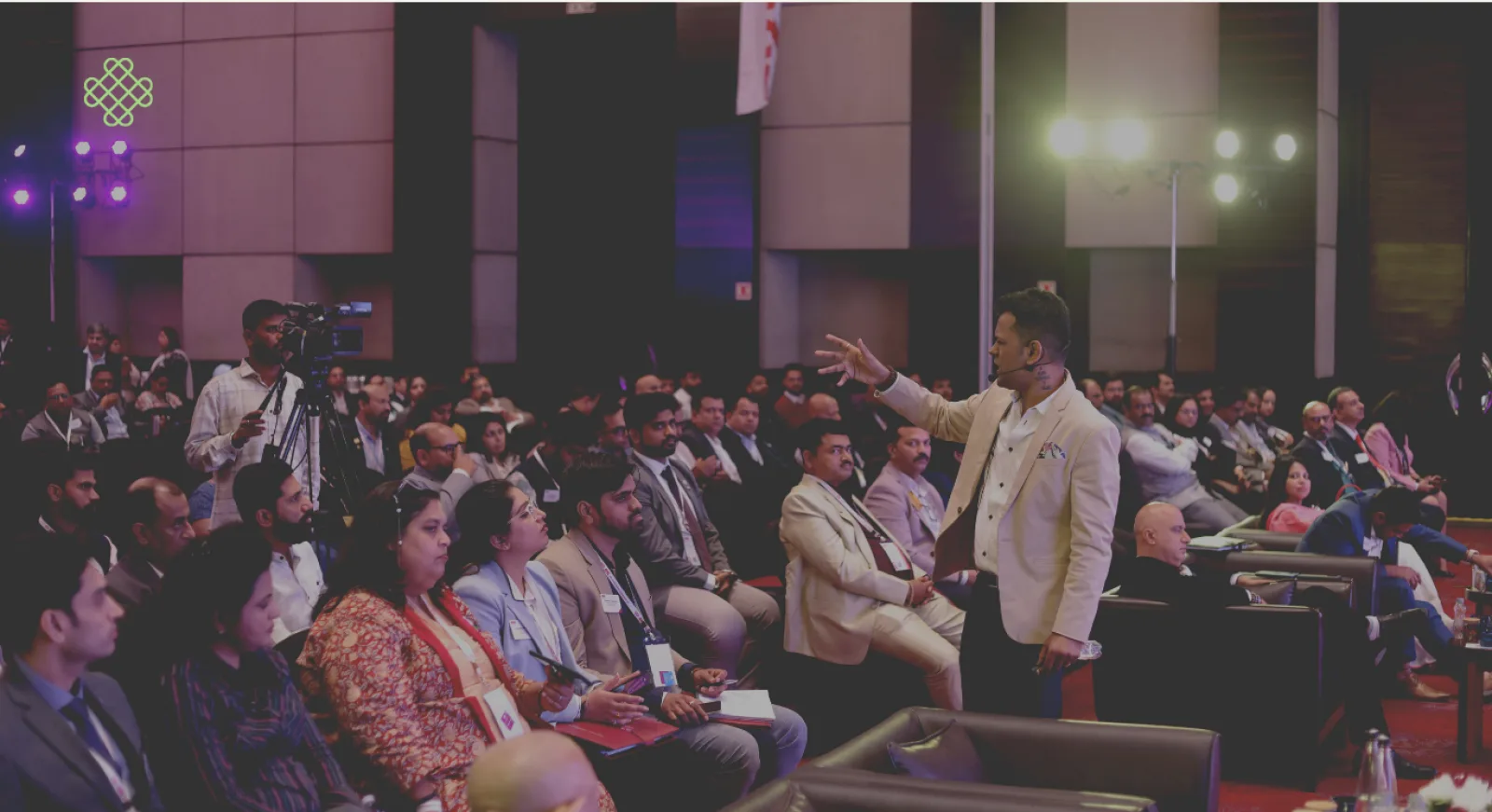 A packed corporate session in progress